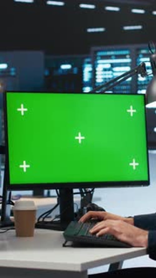 Vertical Video Admin Writing Code on Mockup Computer Monitor to Mend Data Center Racks