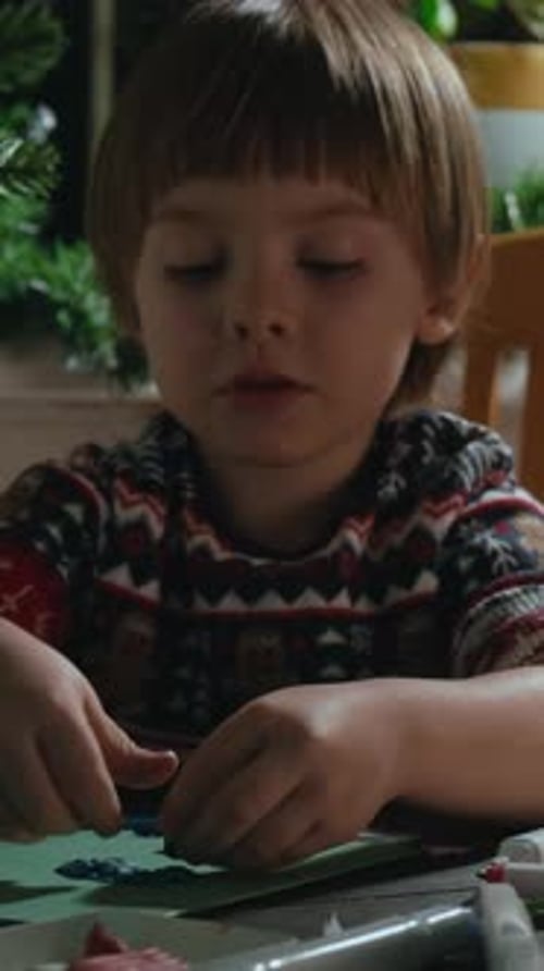Child Creates Art with Paint and Clay