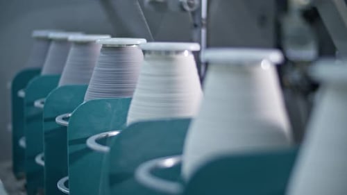 Spools of Thread winding in Textile Factory