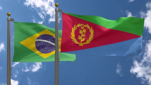 Brazil and Eritrea Flags Waving on Flagpoles Against Blue Sky
