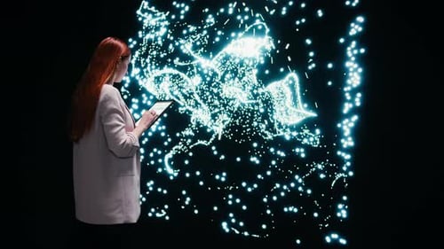 Woman with Tablet Interacting with Futuristic Glowing Display