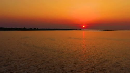 Drone aerial view Sunset Sun Over Sea.Orange Color Sunrise On Beach.Sunset On Sea Dramatic sea