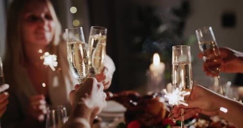 People Celebrate with Sparklers and Champagne Indoors
