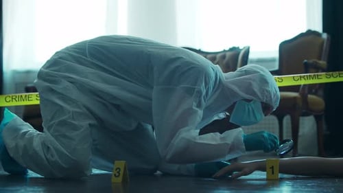 Forensic Investigator Examines Crime Scene Evidence with Magnifying Glass