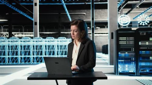 Data Center Female Programmer Uses Laptop and AR Virtualization