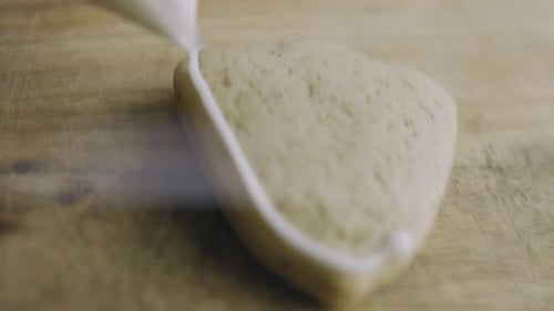 Icing Being Piped Onto Heart Shaped Cookie