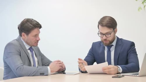Businessman Talking with Employee in Office