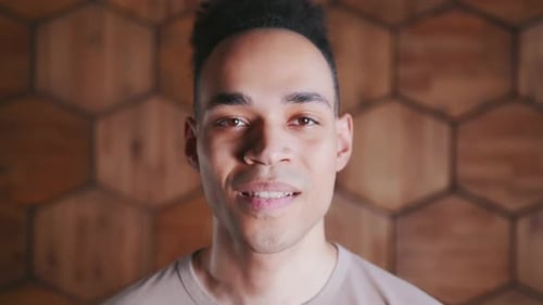 Young Man Smiling Close Up at Camera