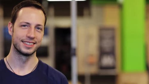 Smiling Young Man Portrait in Office Environment