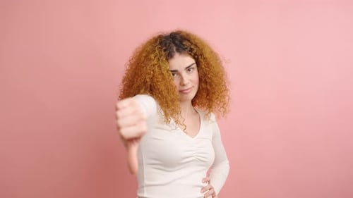 Woman Gesturing Thumbs Down Then Up