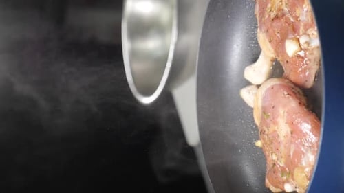 Chicken Thighs Frying in Pan