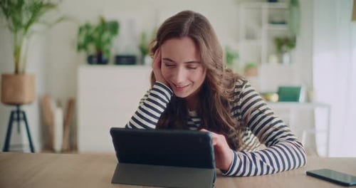 Woman Using Tablet at Home