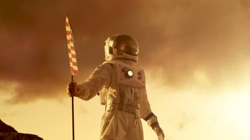 Astronaut Waving American Flag on Red Planet Surface
