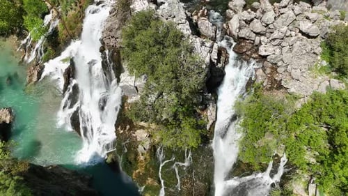 Captivating Wonder Aerial Exploration of the Majestic Waterfall in a Verdant Forest