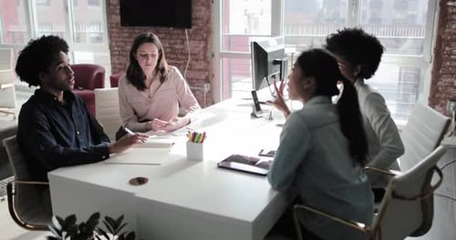 Business colleagues having a brainstorming meeting in an office