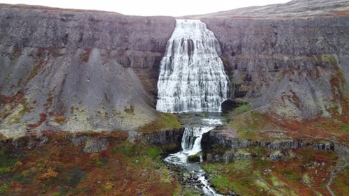 Famous Dynjandi Waterfall in Iceland Nature Pure Glacier Water in Mountain River Aerial Slow Motion