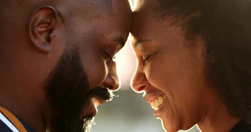 Loving Adult Couple Smiling Face to Face Outdoors