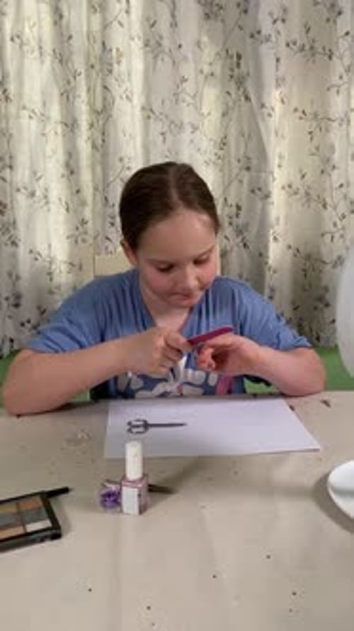 Young Girl Doing Her Nails at Home