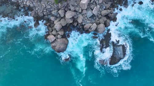Aerial View Stormy Ocean Waves Crashing on Rocks at Dawn Beautiful Sea Surface Texture
