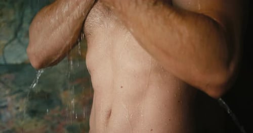 Muscular Torso Showering in Close Up View
