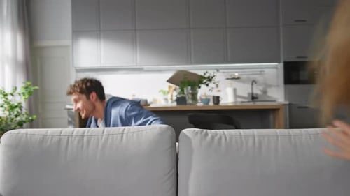 Man Dodging a Pillow at Home Indoors