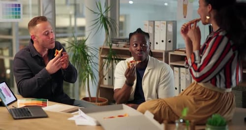 Work, diverse group and pizza at office with happy on break, chatting and enjoying lunch time