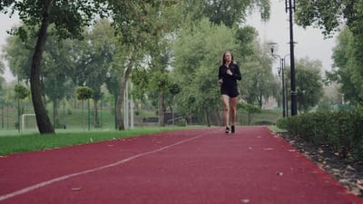 Front view of a woman running - Free Stock Video