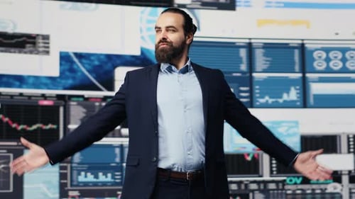 Confident Businessman Spreads Arms Wide in Modern Workplace