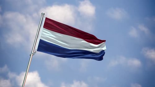 Netherlands Flag Waving in Wind Against Blue Sky