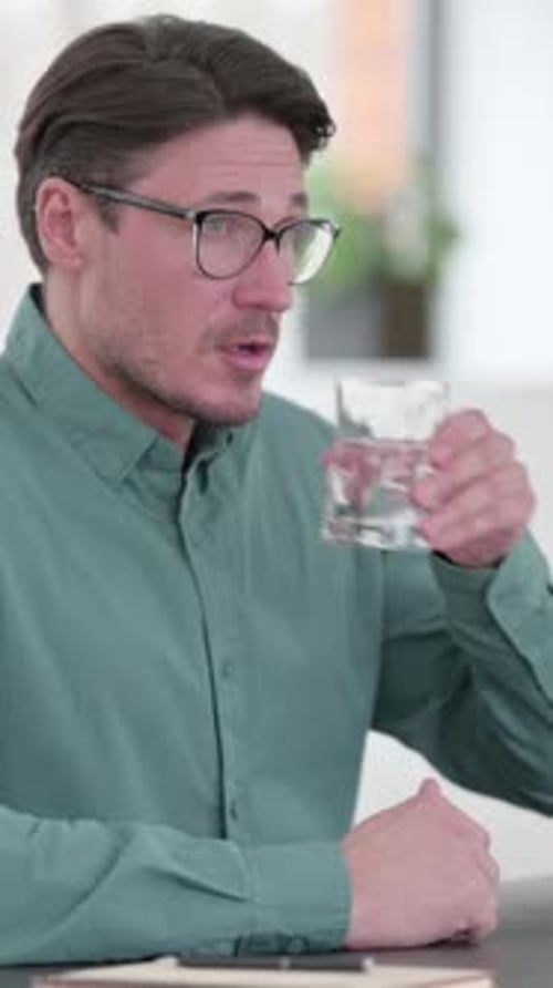 Young Man Feeling Shocked in Cafe, Vertical Video