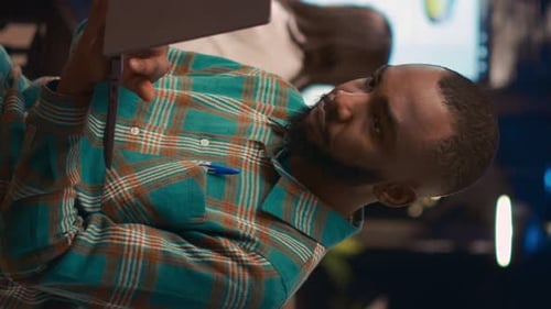 Smiling Man with Tablet in Modern Office