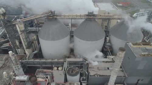 Woodworking Factory Aerial View of Pipes and Tanks Industrial Landscape Smoke From Pipes