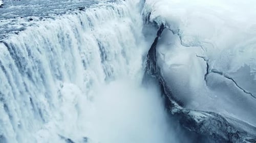 Dettifoss Waterfall in Iceland Frozen Winter Landscape with Snow and Ice Aerial View