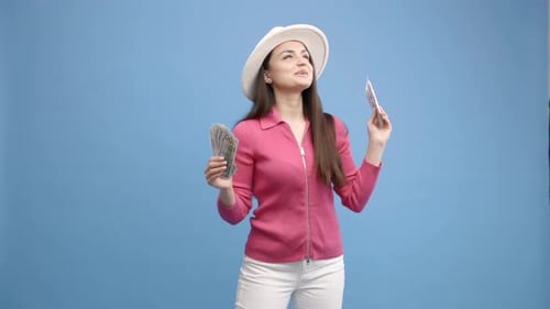 Woman Holding Money and Ticket Excited for Travel