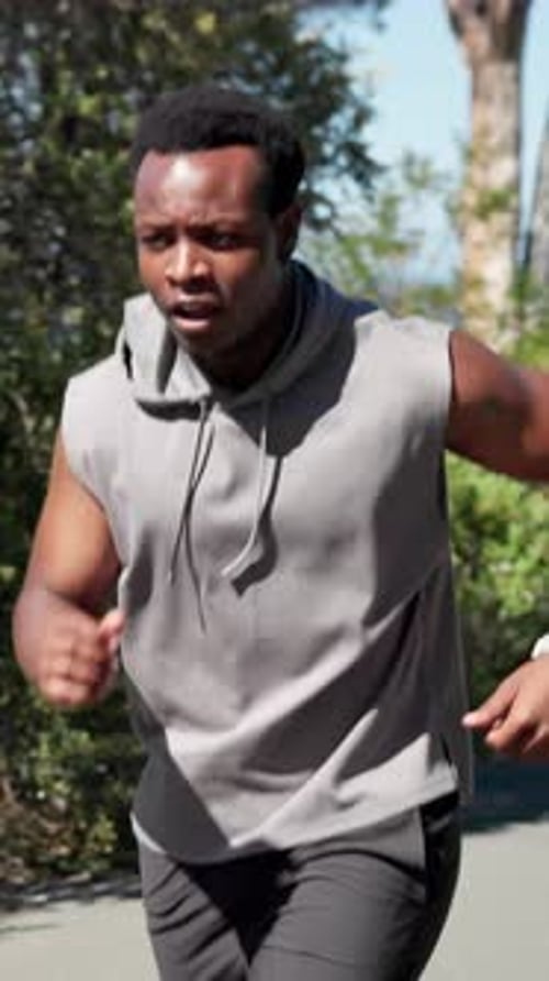 Runner, check time and black man with fitness, smile and cardio workout with challenge
