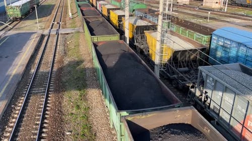 Freight Train with Coal Moving on Train Station Aerial View