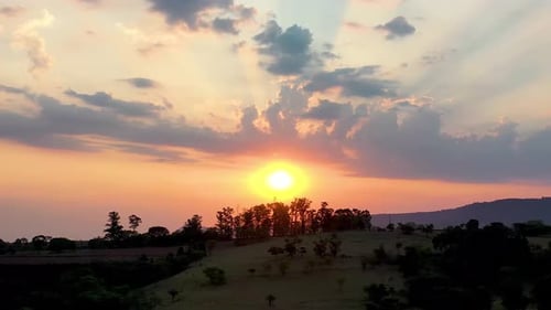 Panorama sunset rural landscape. Countryside scenery aerial view. Colorful sunset skyline.