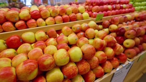 Apples on display in a grocery store. Organic apples for sale in the produce section of a grocery st
