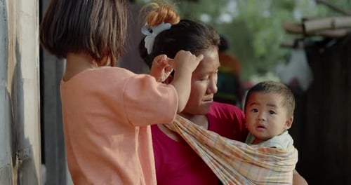 A Thai woman which is a single mother working as a farm laborer in rural Southeast Asia