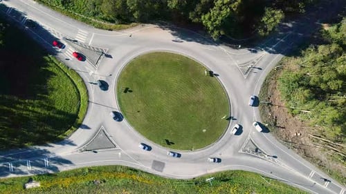 Top Drone View of the Roundabout and Cars Moving on It Roundabout with Four Exits Resolution Drone