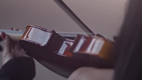 Woman Playing Violin Close Up