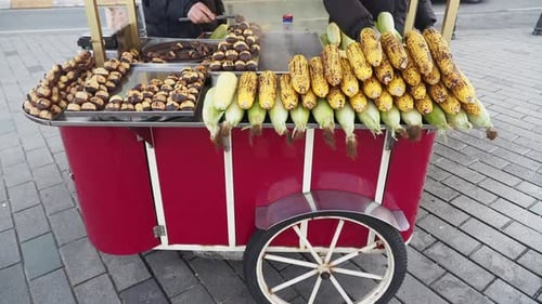 A Street Vendor Sells Roasted Corn