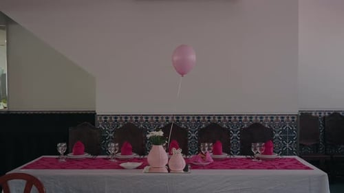 Celebration table setting with balloon in event venue