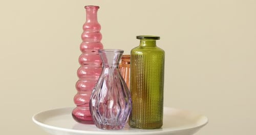Colorful Glass Vases on a White Plate