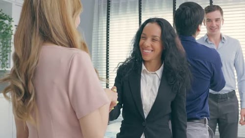Business Meeting Handshake in a Modern Office