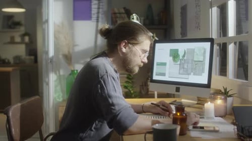 Man Working at Desk on Design Project