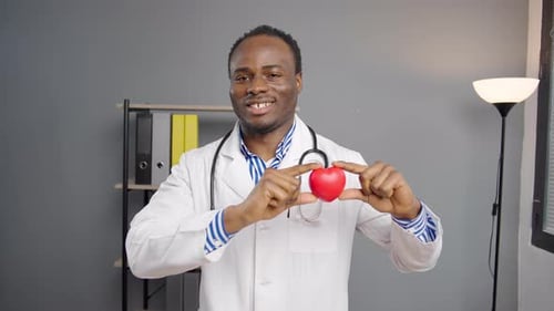 Doctor Holds Red Heart, Health and Medical Concept