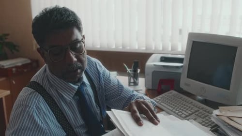 90s Office Worker Overloaded with Monotonous Work with Papers