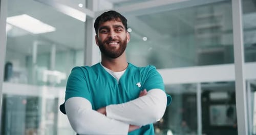 Arms crossed, smile face and nurse man in hospital for professional healthcare or medical career
