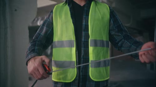 Caucasian Handyman Man Looking Measuring Ruler Tape in Construction Repairman Guy Male Architect